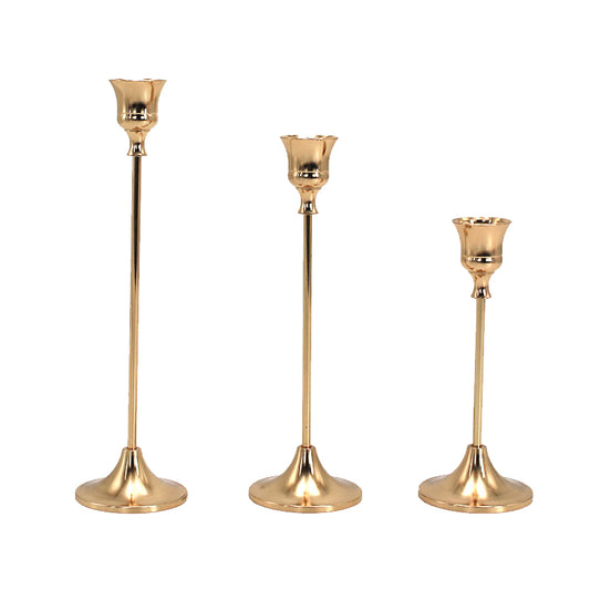 Set of 3 gold candle stick holders